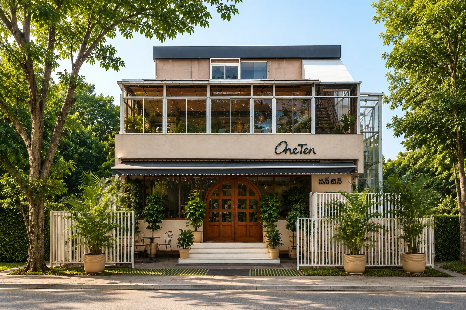 Cafe OneTen exterior — entrance nestled between trees, Nallagandla